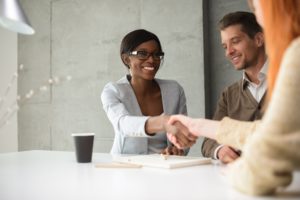 female-accountant-shakes-hands-with-clients