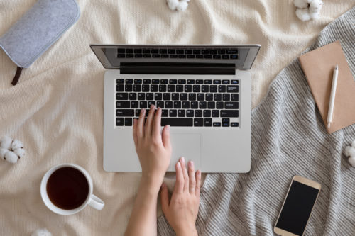 laptop-mug-filled-with-coffee-and-hand-prepared-to-start-blogging