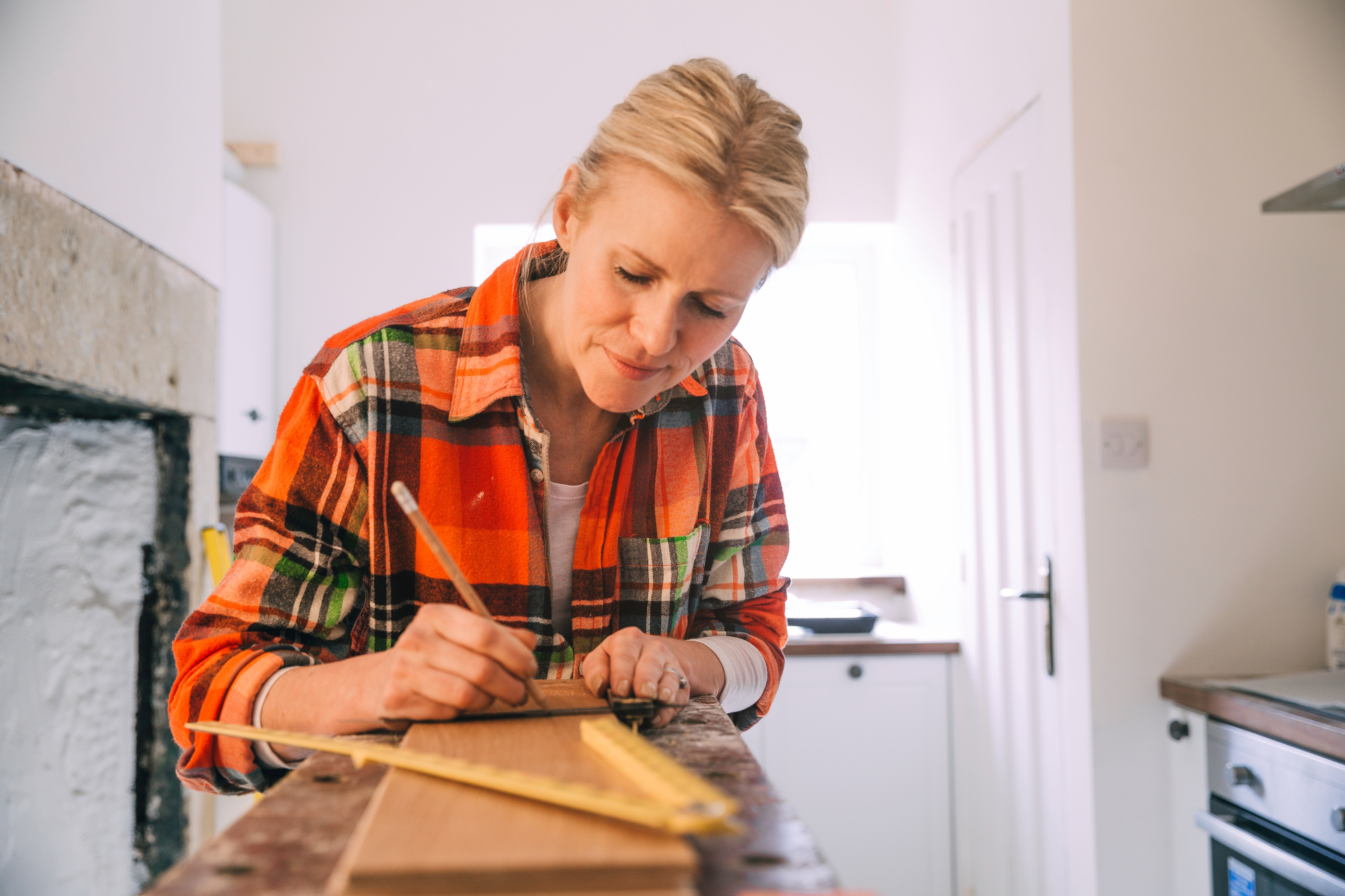 female contractor planning kitchen renovation