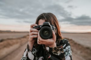 young photographer using a DSLR camera